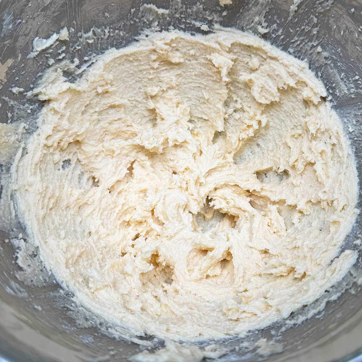 In a mixer bowl the creamed butter and sugars are mixed for 3 minutes.