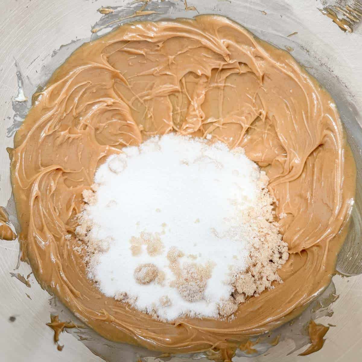 Adding the sugars to the peanut butter mixture.