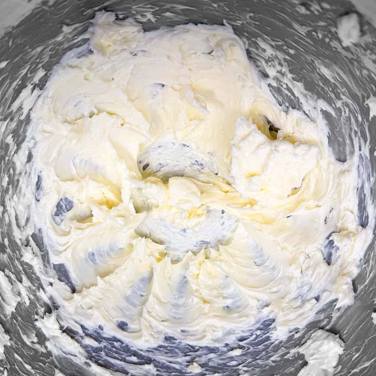 Creamed butter in a mixer bowl after 1 minute on a medium mixer speed.