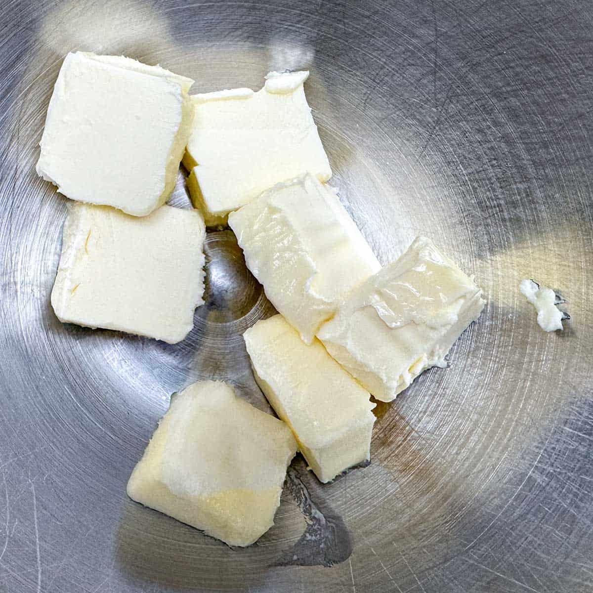 Cubed butter in the mixer bowl.