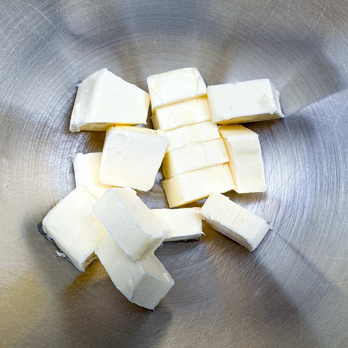 Cubed butter in the mixer bowl.