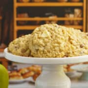Apple caramel oatmeal cookies on a pedestal for feature photo.