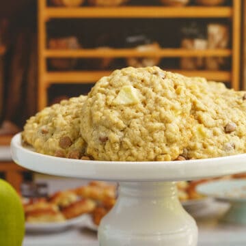 Apple caramel oatmeal cookies on a pedestal for feature photo.