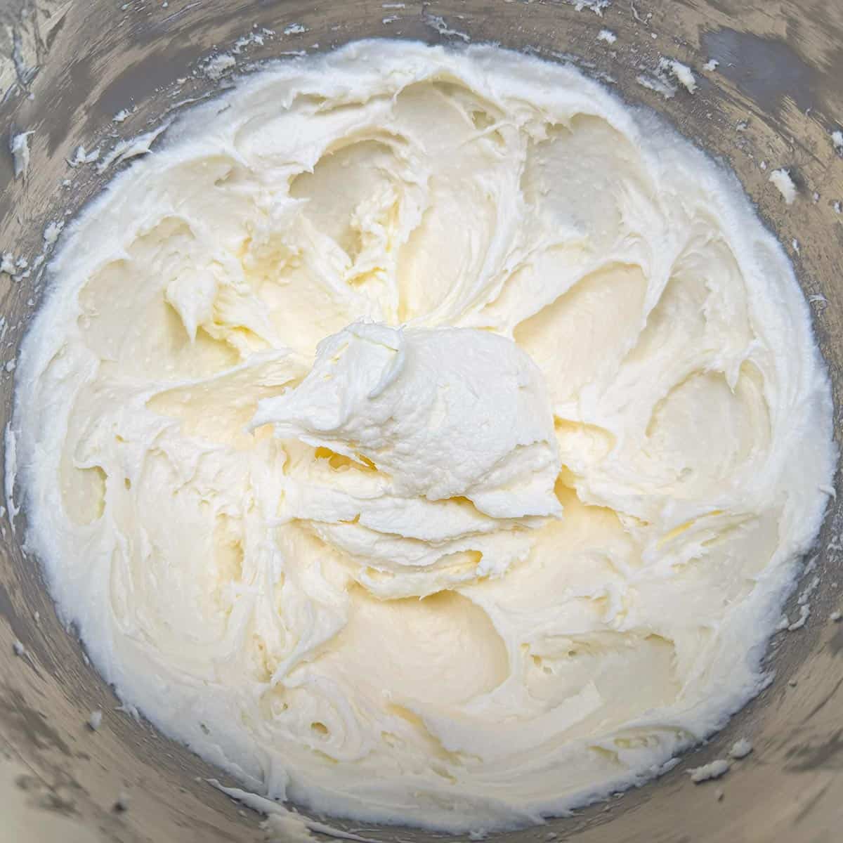 Butter, cream cheese and sugar mixed for 3 minutes. Looks creamy and whipped.