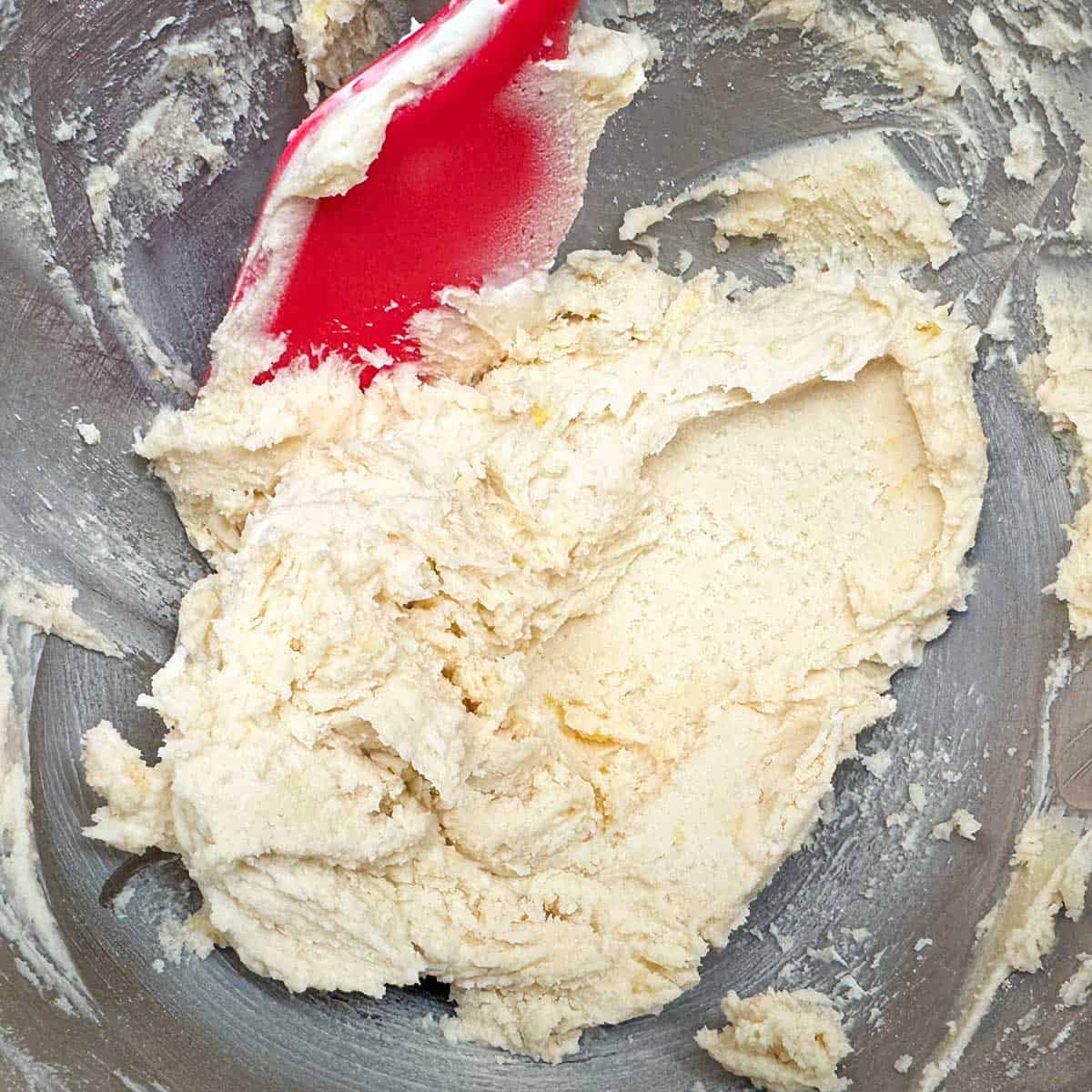 Cookie dough comes together after the flour is added.