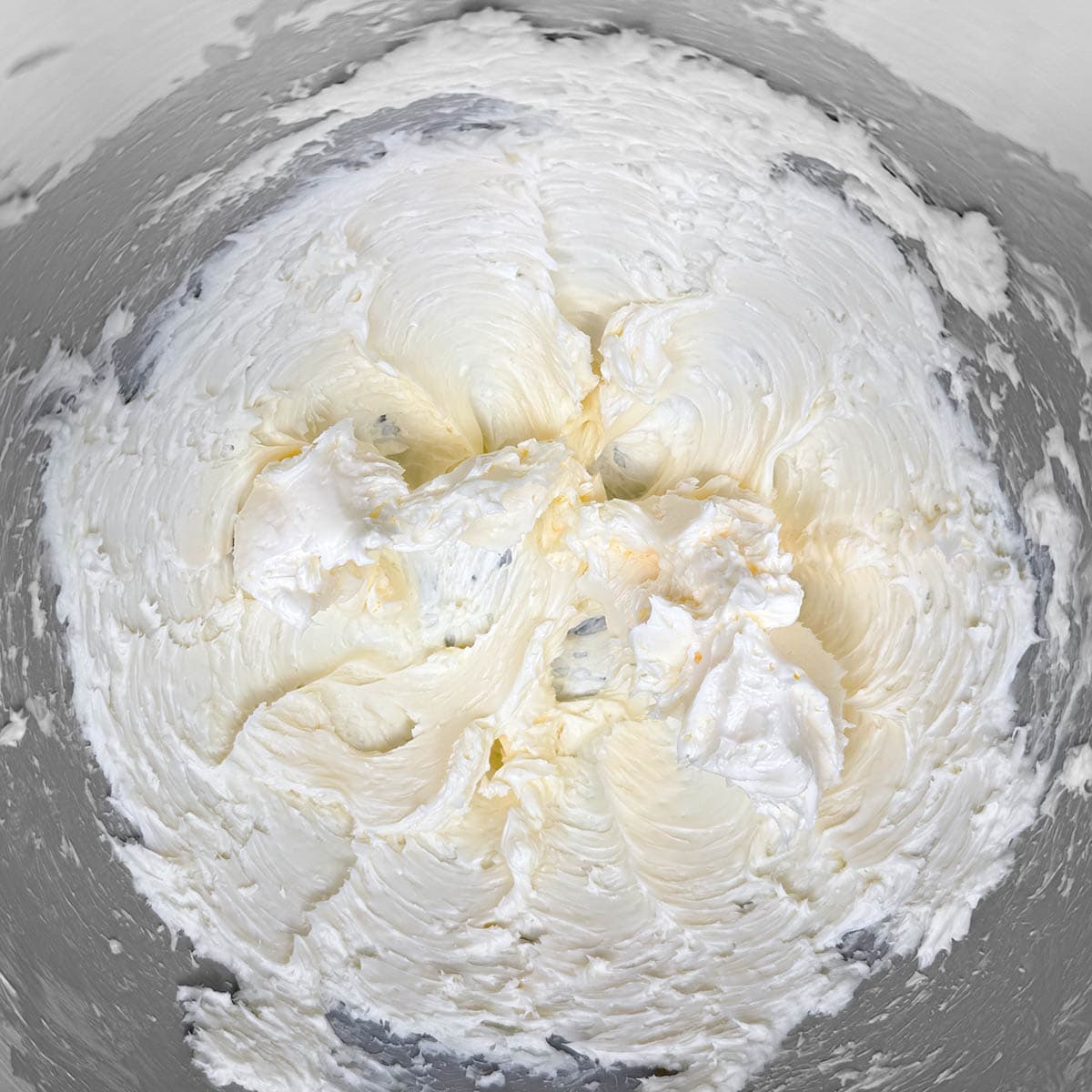 Creamed butter in a mixer bowl.