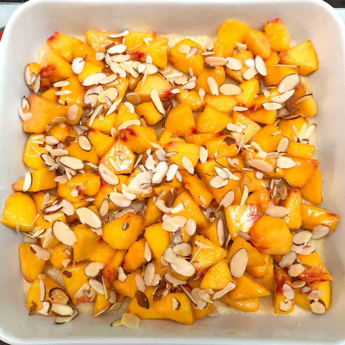 Peaches layered onto the par-baked shortbread crust.