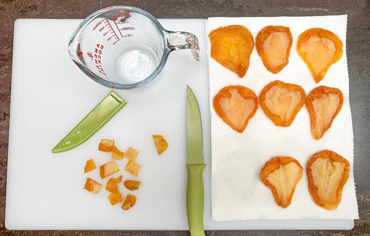 Cutting up the infused dried pears.