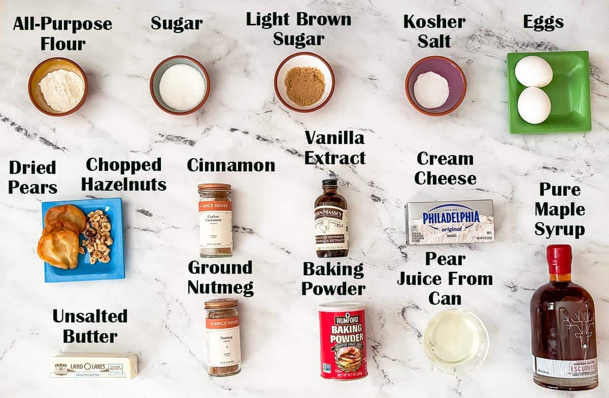 Ingredients to make pear and hazelnut cookies laid out on a board