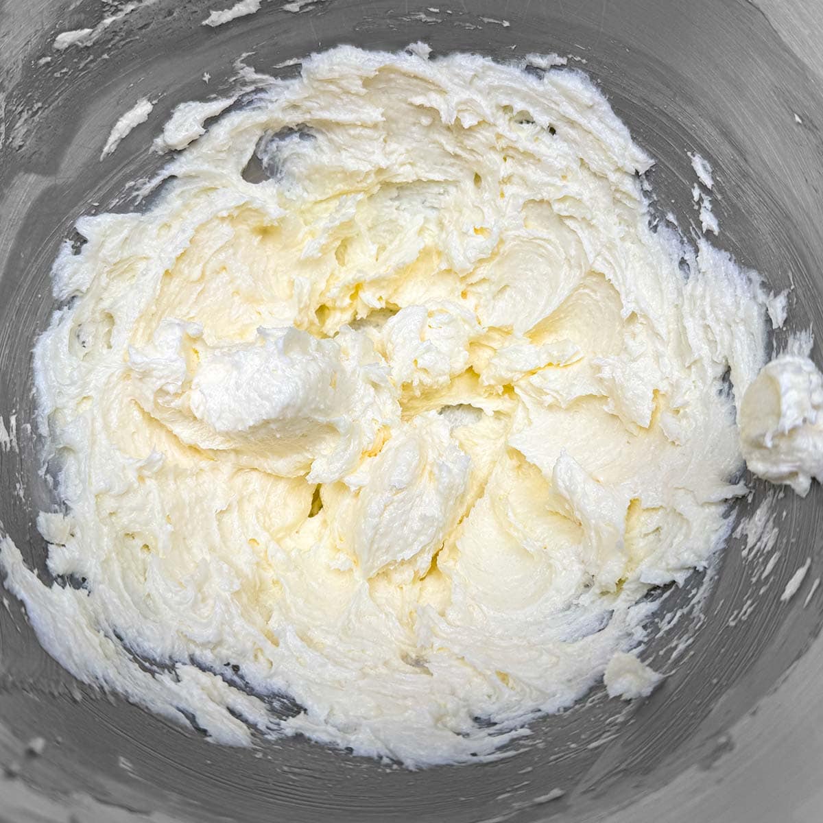 Butter and sugar mixed for three minutes until it is fluffy looking.