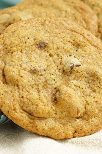 Chocolate chips with glazed pecans cookies close-up picture.