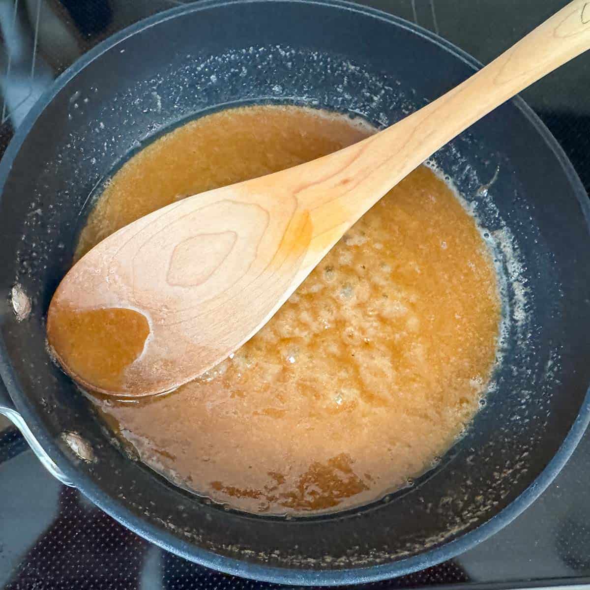 In a small frying pan reducing the brown sugar and butter to coat the pecans.
