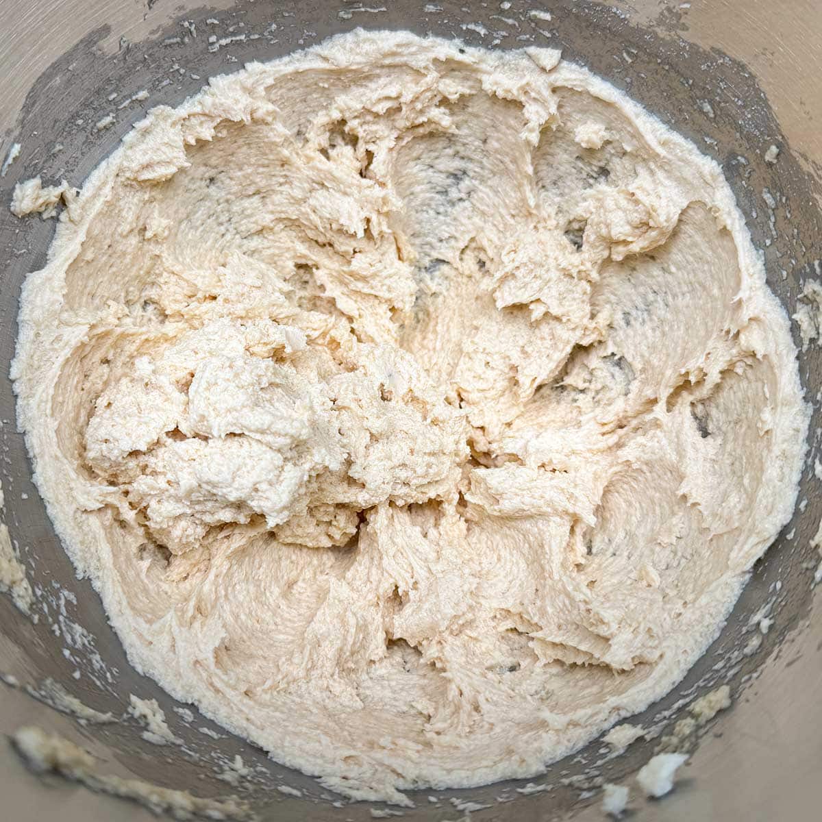 Both white and brown sugars added to the butter mixture and mixed three minutes to fluffy peaks.