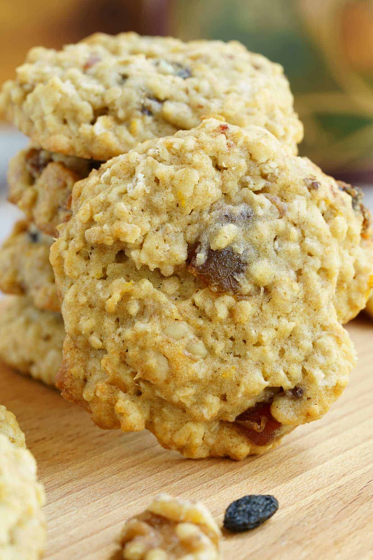 Full length of stack of cookies with one standing up leaning against the stack.
