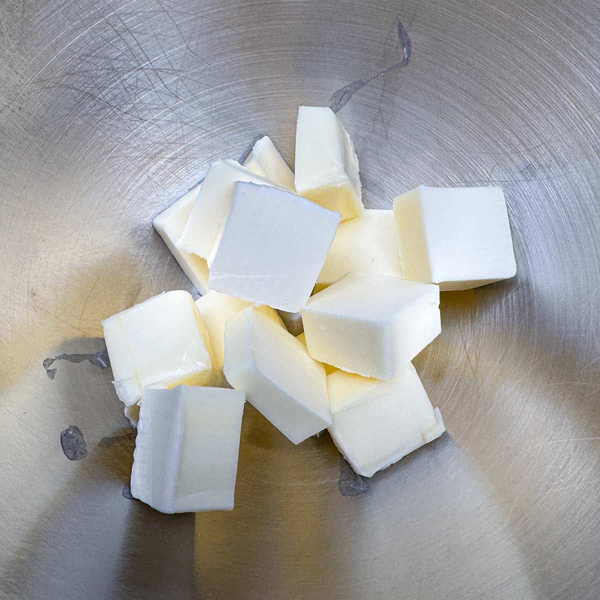 Cubed butter in a mixer bowl coming to room temperature.