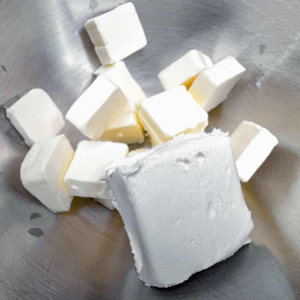 Cubed butter and the cream cheese ready to be mixed together.