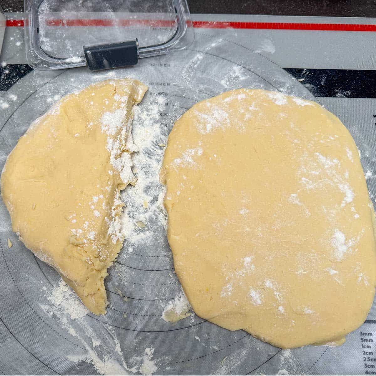 Diving the cookie dough in half to make two rolls. Flatten and wrap for two hour chill.