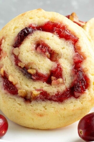 Apple Cranberry Walnut Swirl Cookies front view showing the swirls and whole cranberries. .