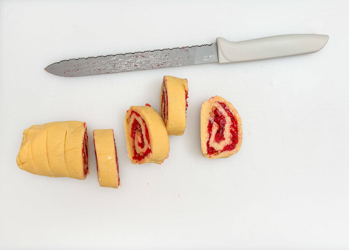 Using a serrated knife to make the sliced cookies