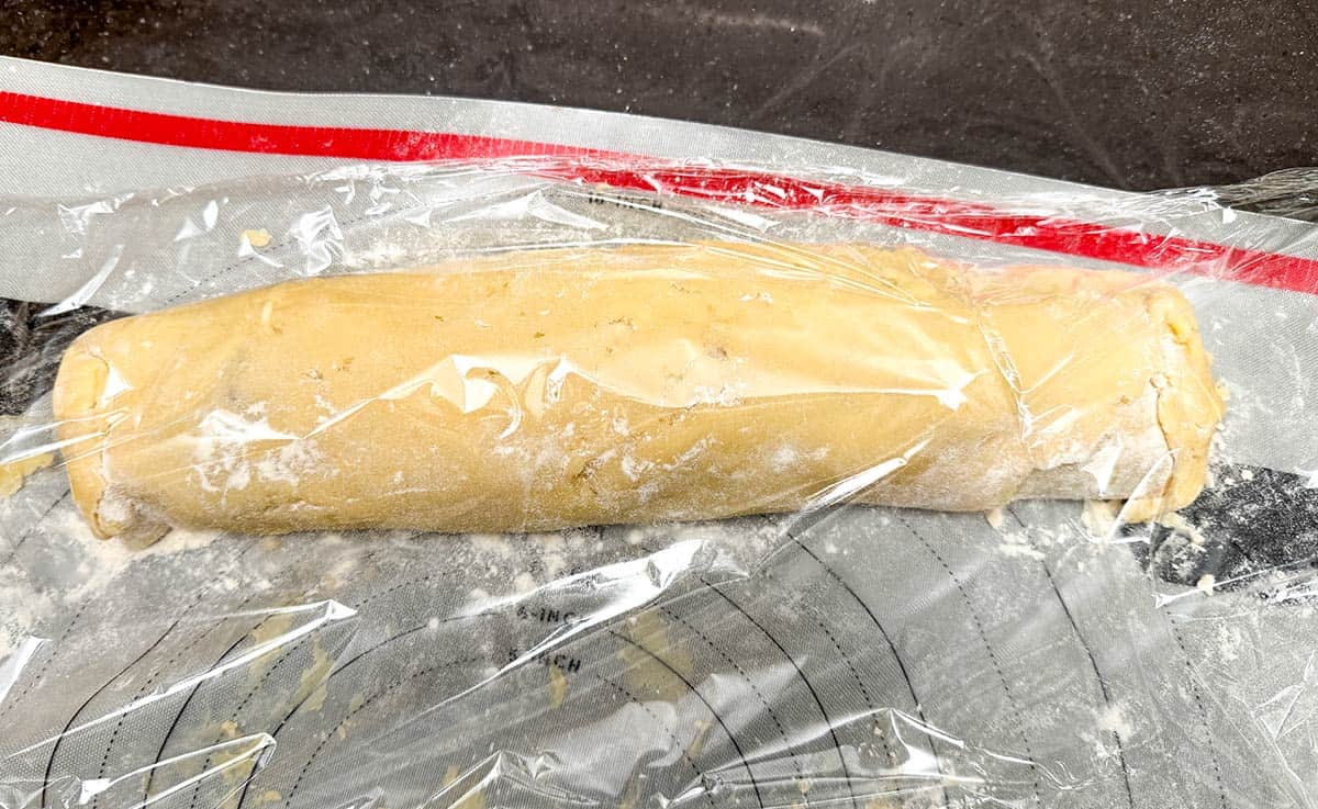 Filled log getting wrapped in plastic wrap for the overnight chill.