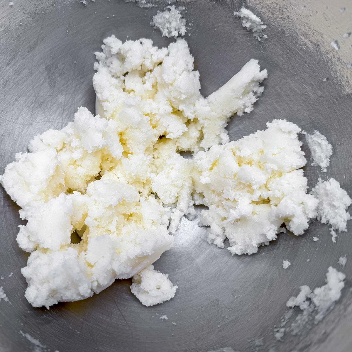 Sugar and the creamed butter mixed, but looks chunky due to more sugar than butter.