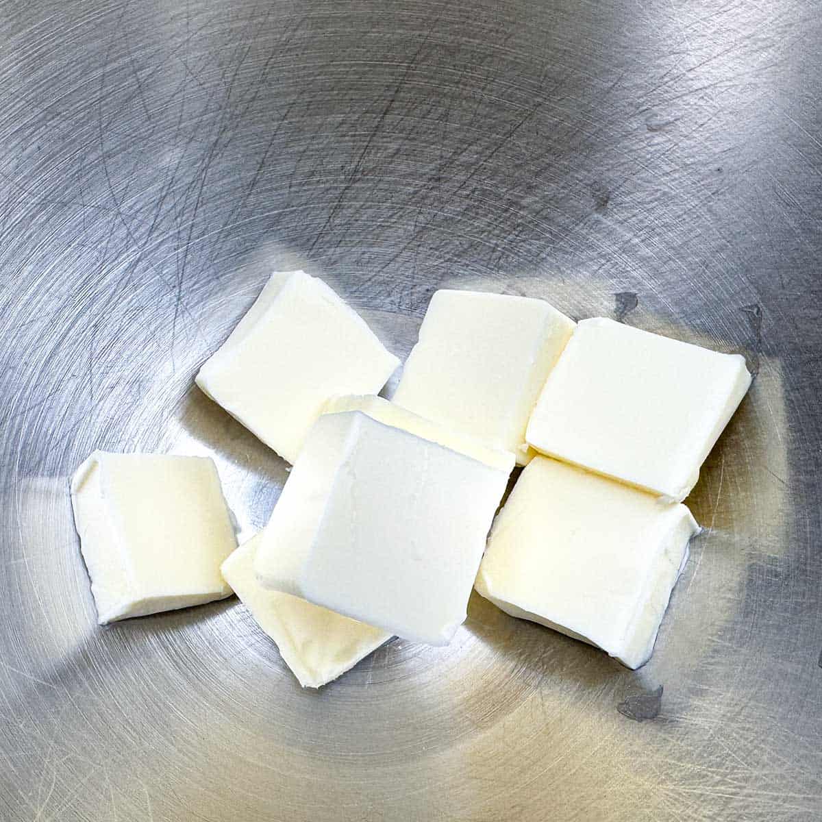 Cubed butter in the mixer bowl.