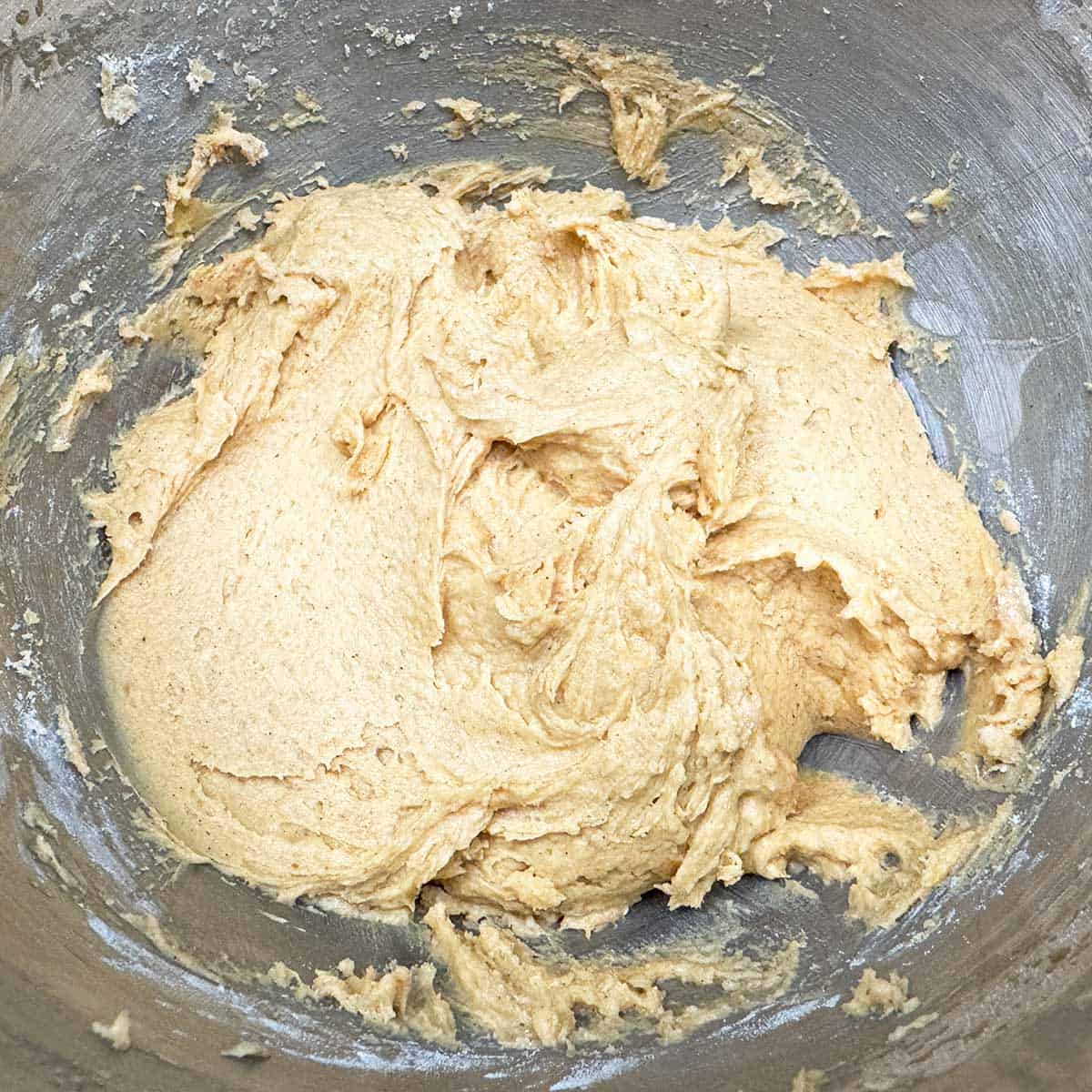 The cookie dough in a mixer bowl just before the walnuts are added.