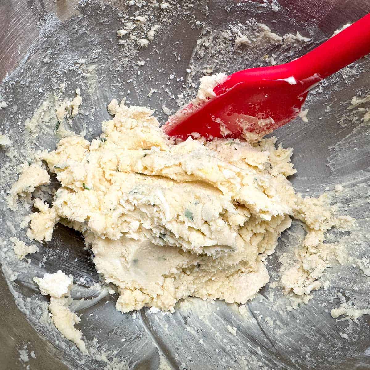 Added flour mixture to the wet ingredients in a mixer bowl.