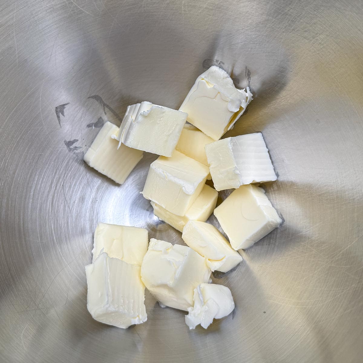 Cubed butter in the mixer bowl ready to be creamed.