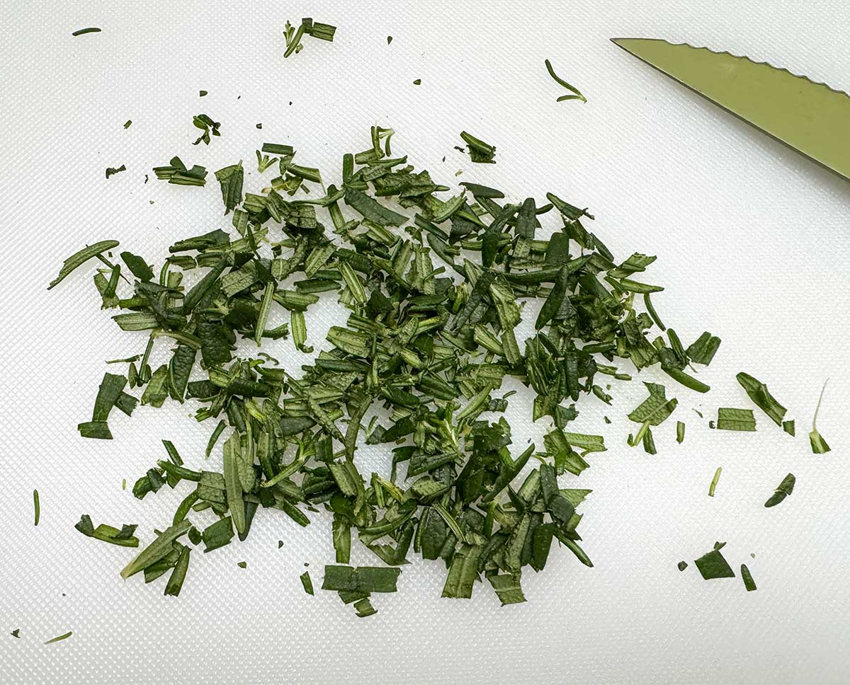 Fresh rosemary getting diced up for cookie dough.