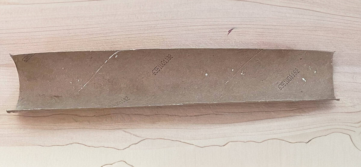 Paper towel cut in half lengthwise to cradle cookie logs.