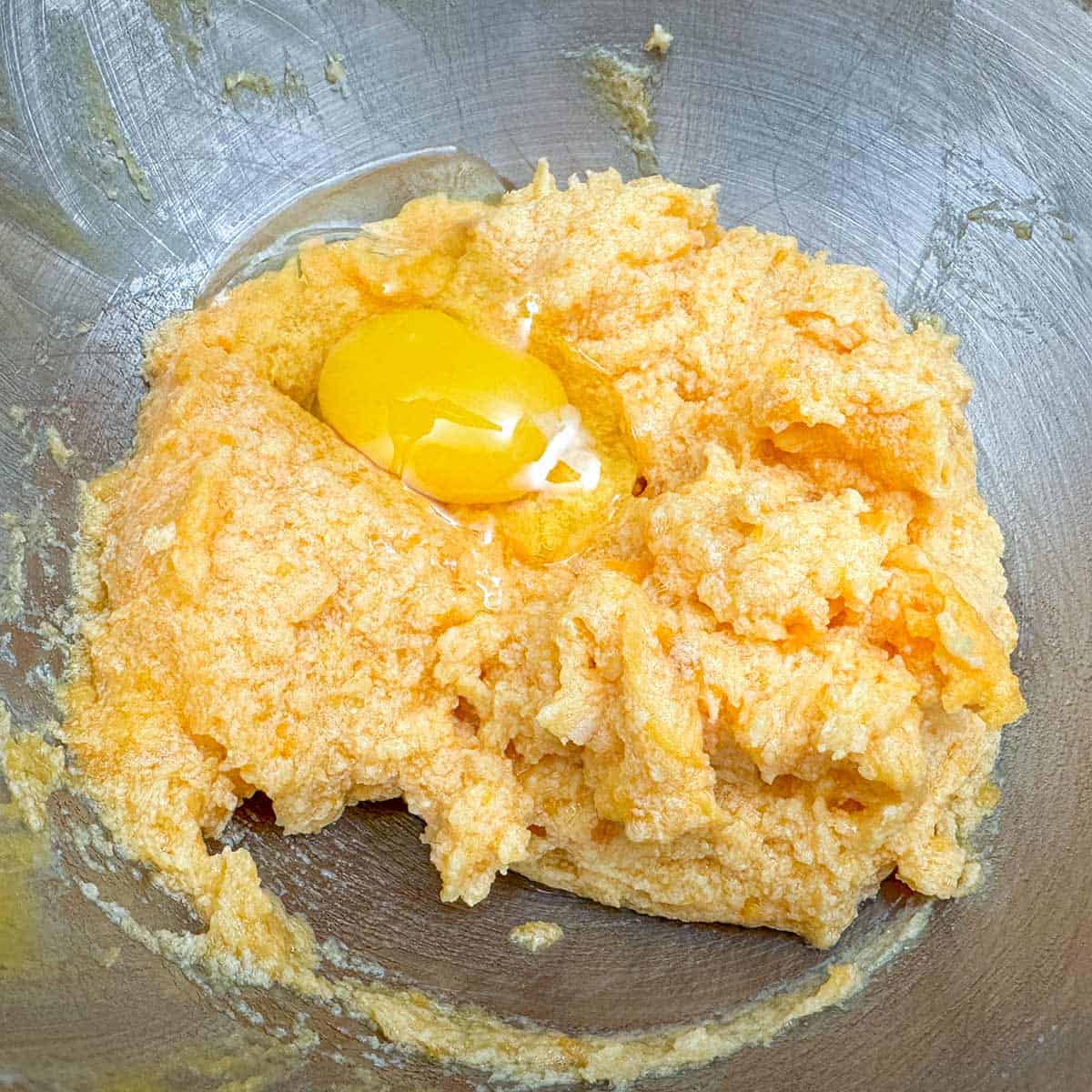 Adding the vanilla extract, maple syrup and egg to the mixture.