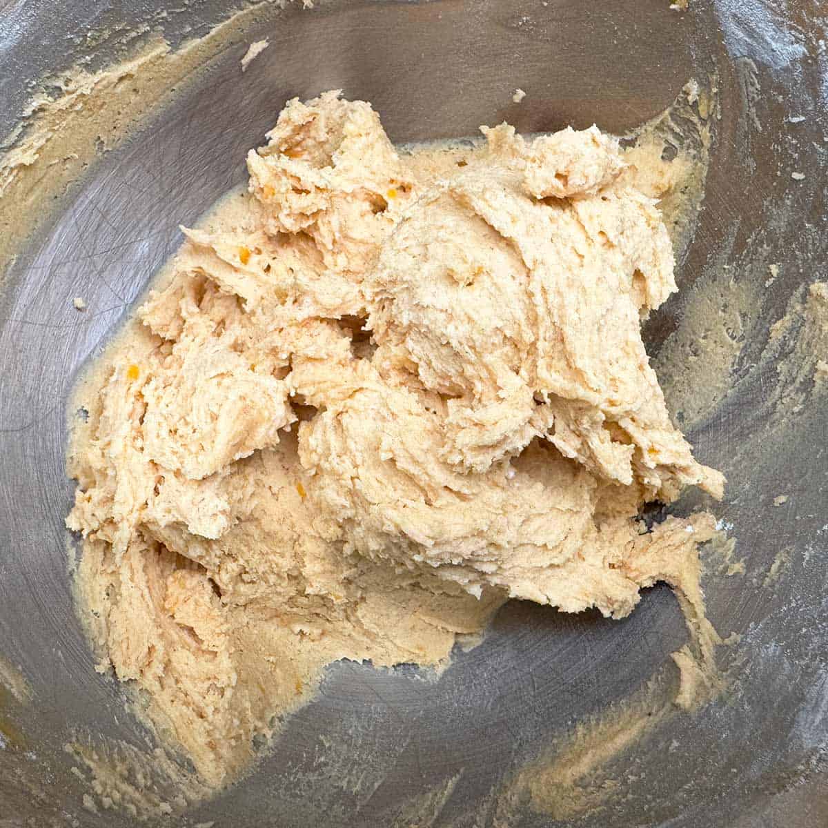 Flour added to the wet ingredients for the cookie dough.