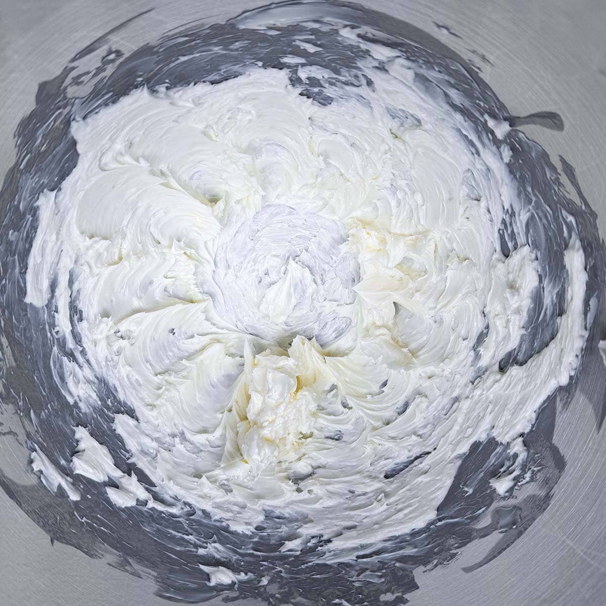 Creamed butter in a mixer bowl.