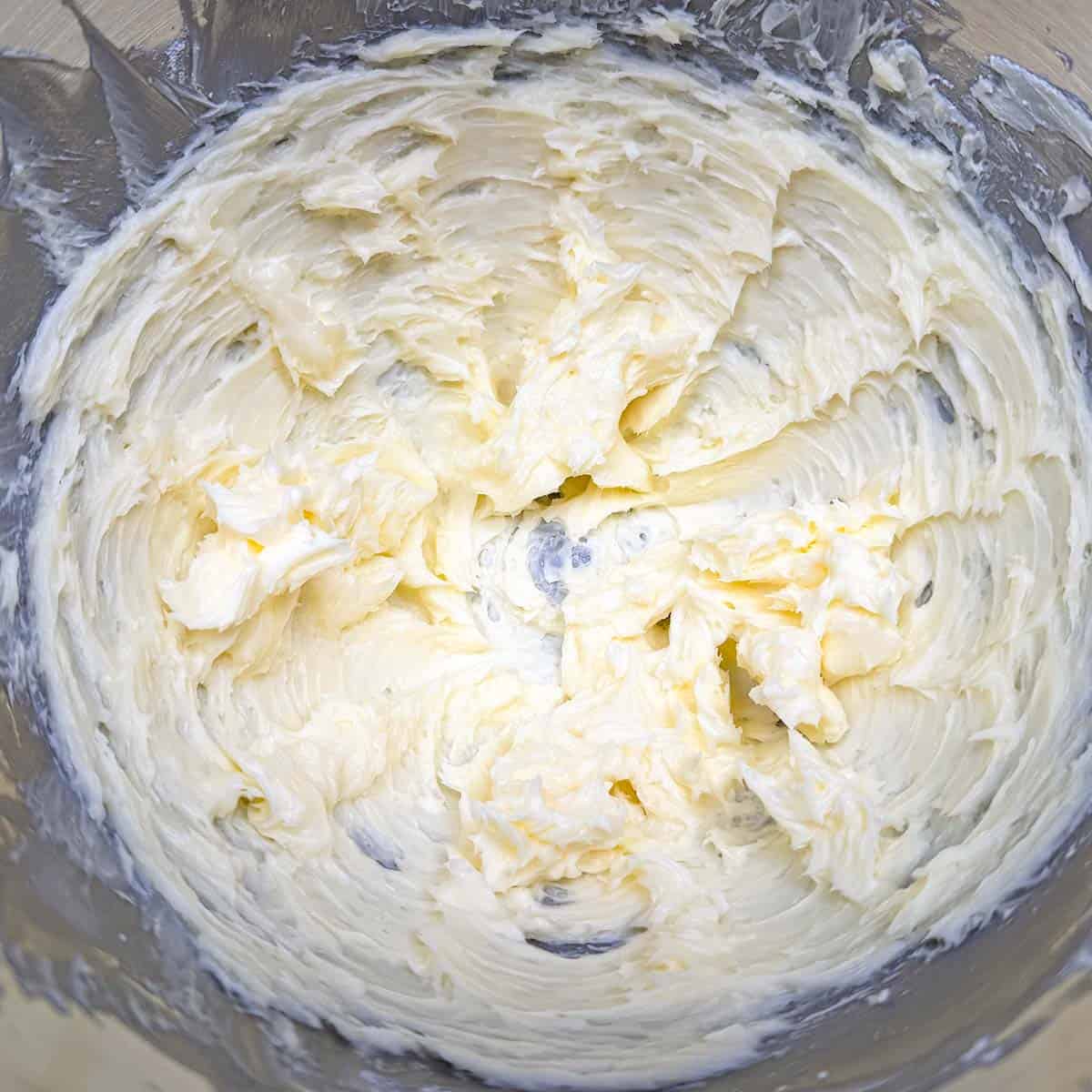 Creamed butter and sugar that has been mixed for 3 minutes in a mixer bowl.
