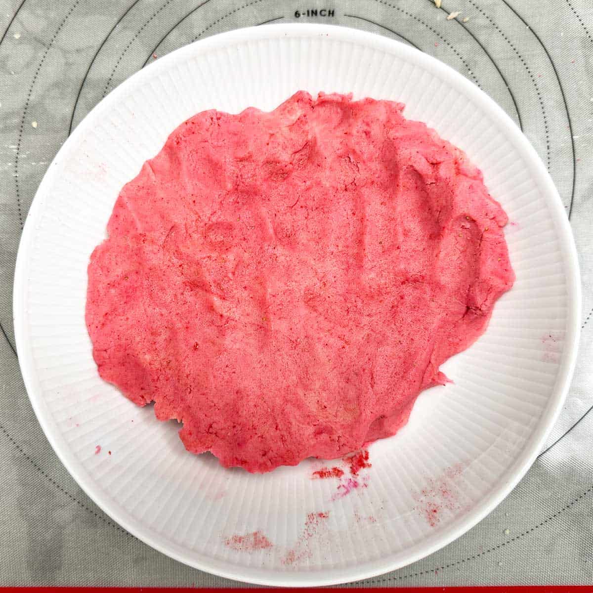 After adding the freeze-dried strawberries that has been crushed and sifted along with the strawberry extract and the pink gel coloring.