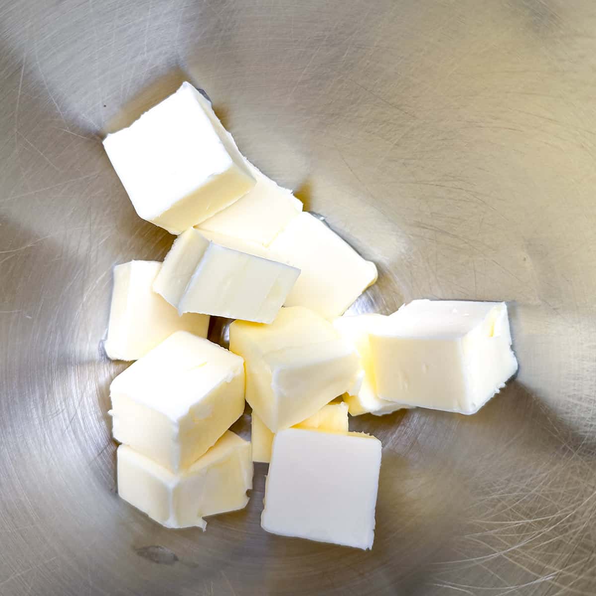 In a mixer bowl butter that has been cubed.