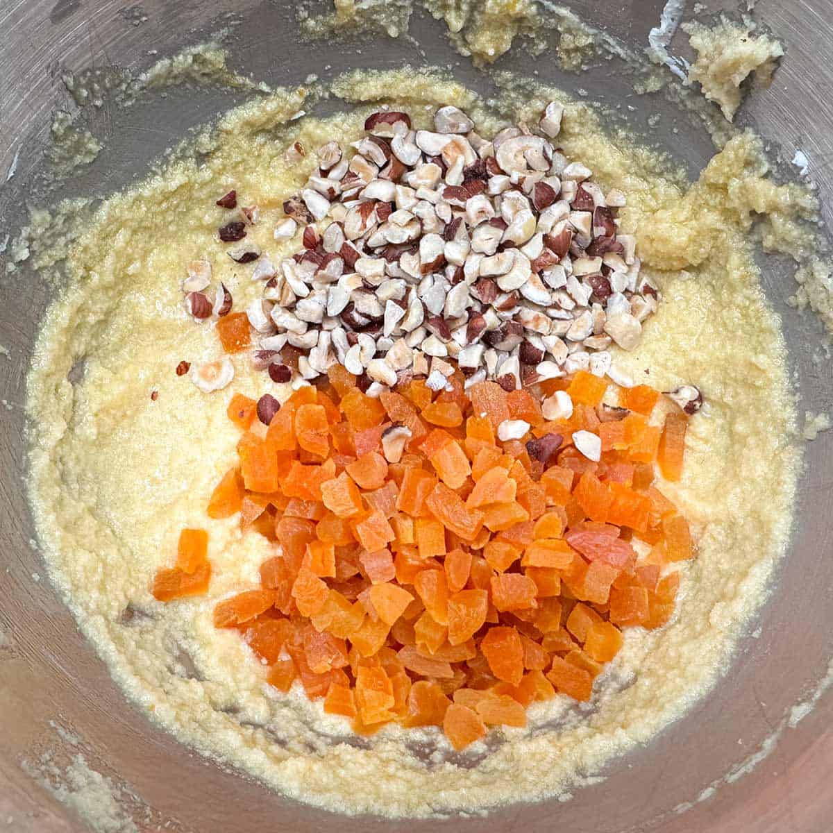 Wet cookie dough and adding chopped apricot and hazelnuts.
