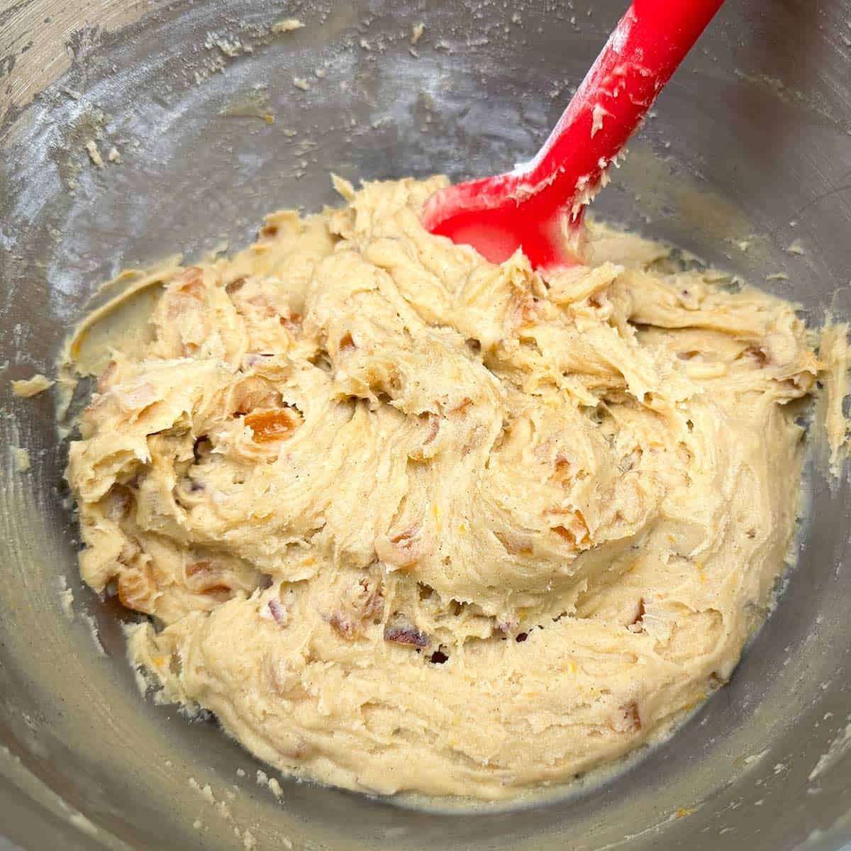 The complete cookie dough in a mixer bowl.