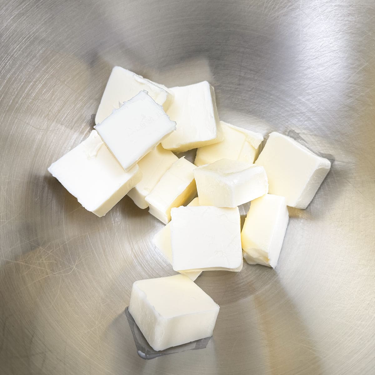 Cubed butter in the mixer bowl.