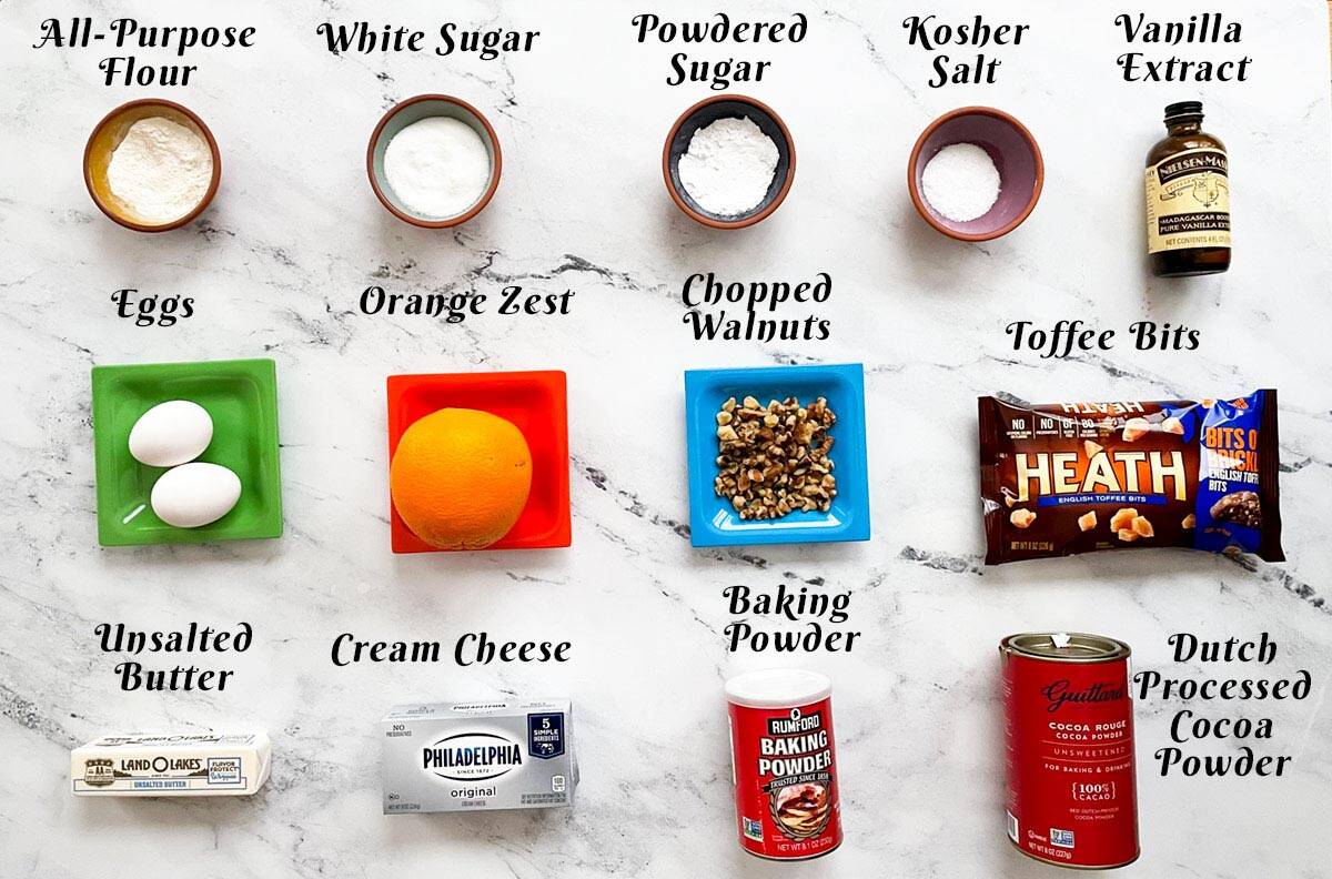 Chocolate Orange Toffee Cookies ingredients laid out on a board.