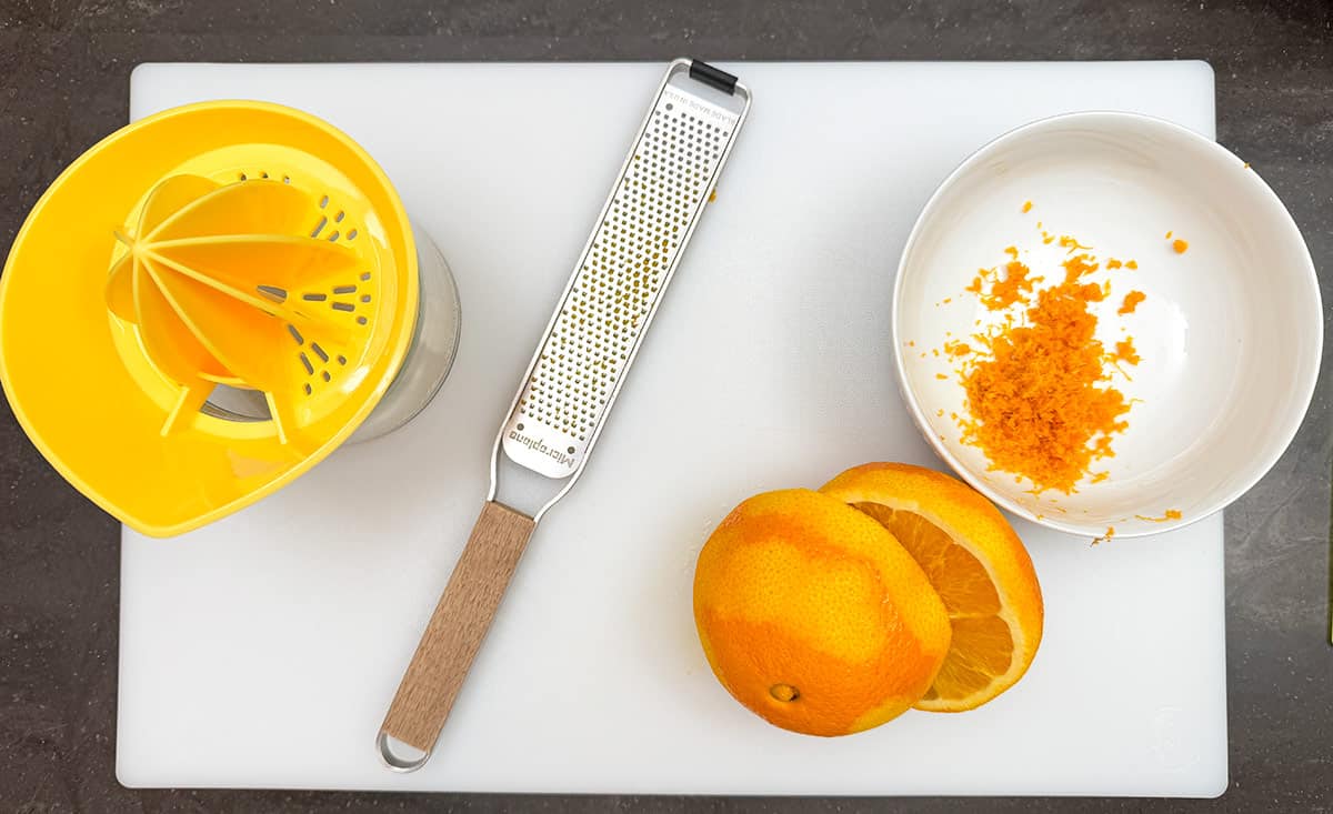 Tools for zesting and juice an orange.