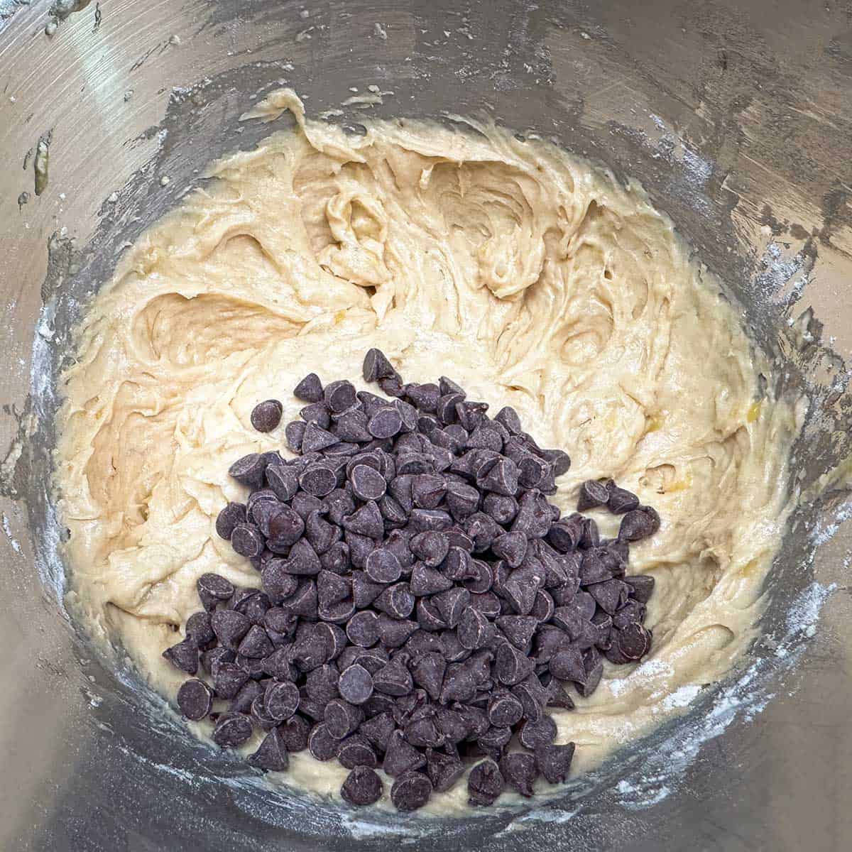 Mixing the chocolate chips into the cookie dough.