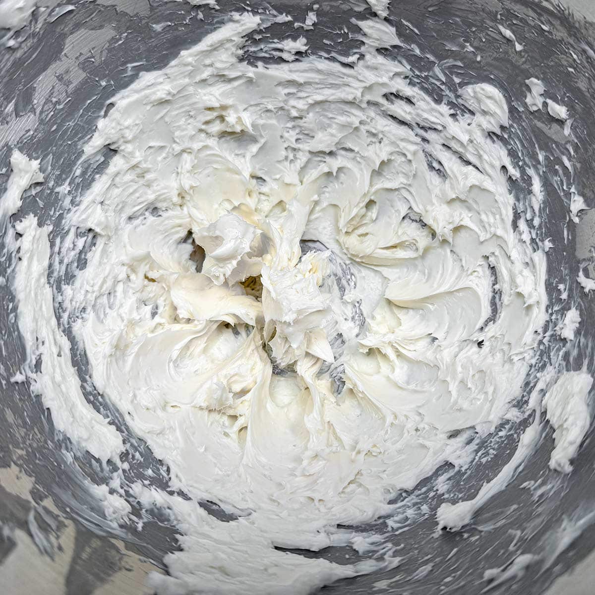 Creamed butter in a mixer bowl.