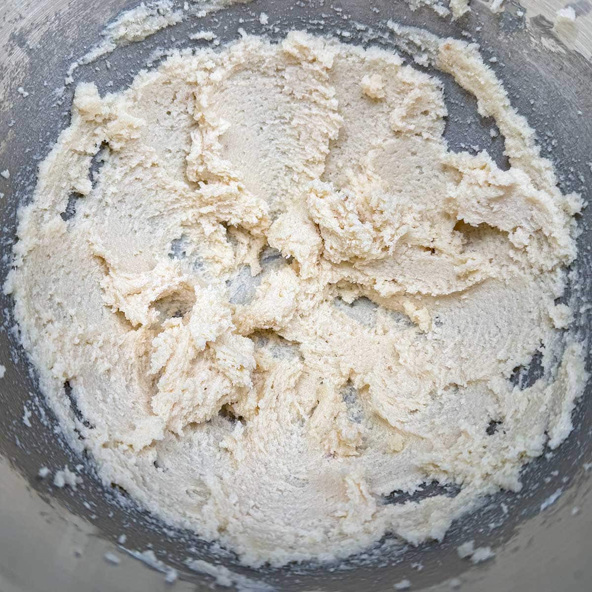 Butter and both sugars mixed together in a mixer bowl.