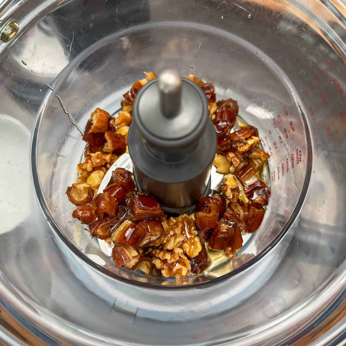 Chopped dates and walnuts with the maple syrup in a food processor.