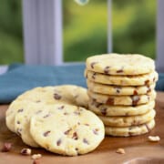 Featured Orange cinnamon chip sugar cookies on a wooden board.