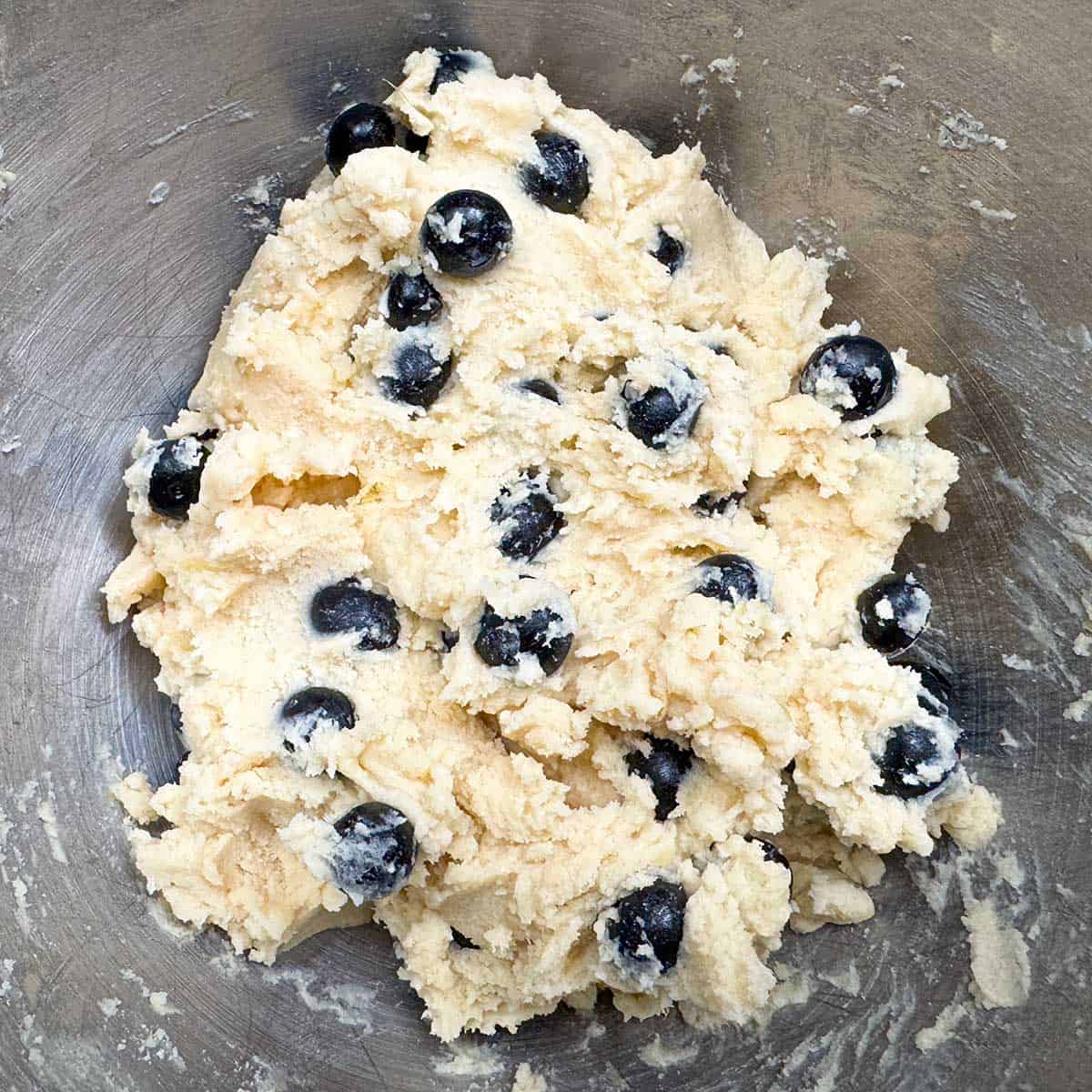 Infused blueberries mixed into the cookie dough.