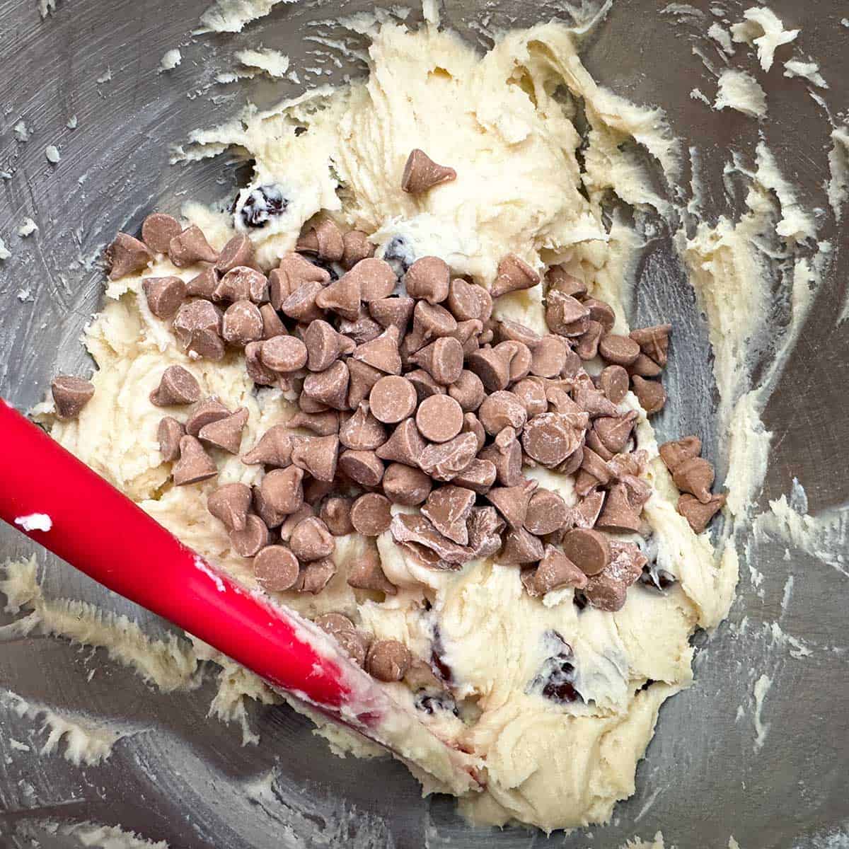 Adding the caramel sea salt chips to the cookie dough.