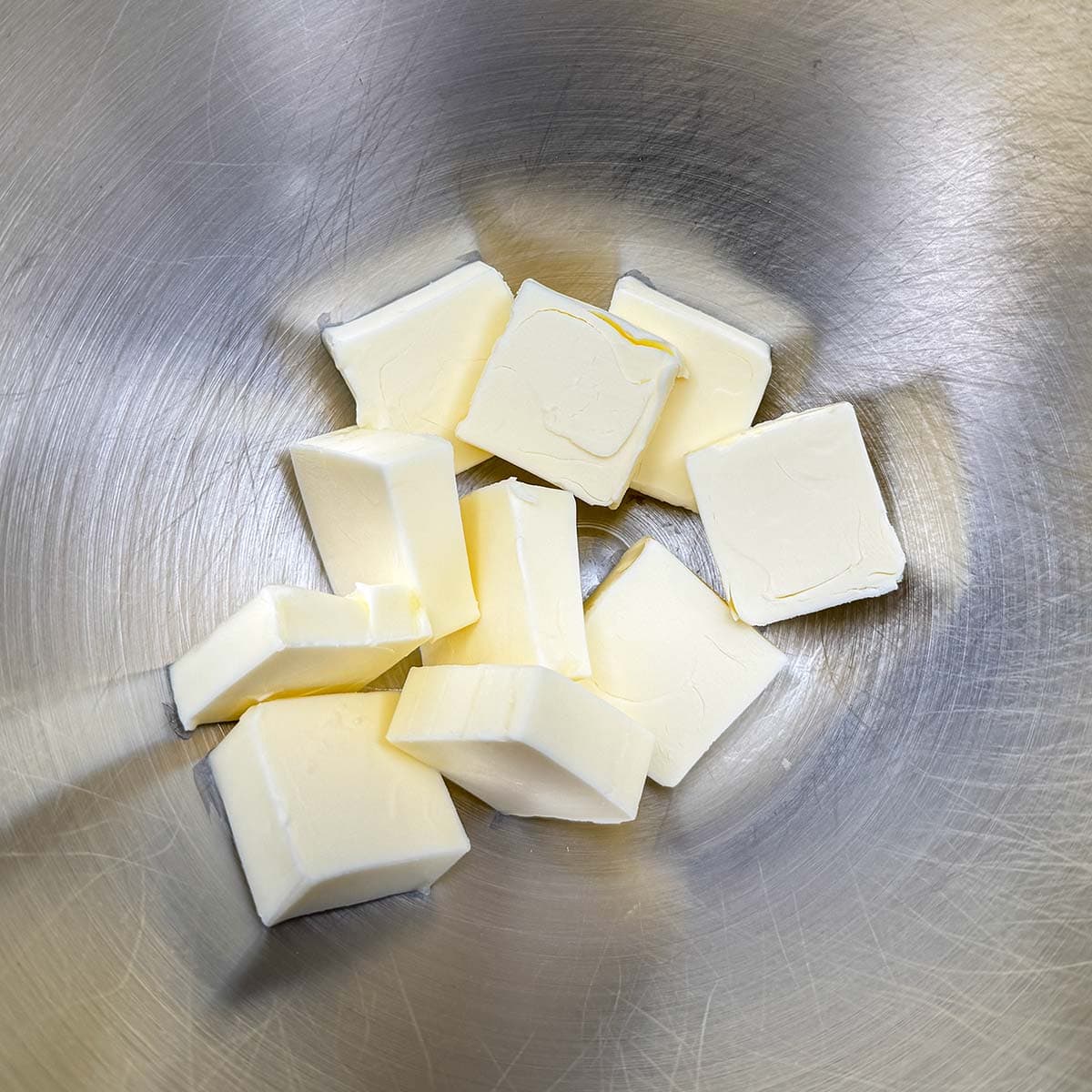 Cubed butter in a mixing bowl.